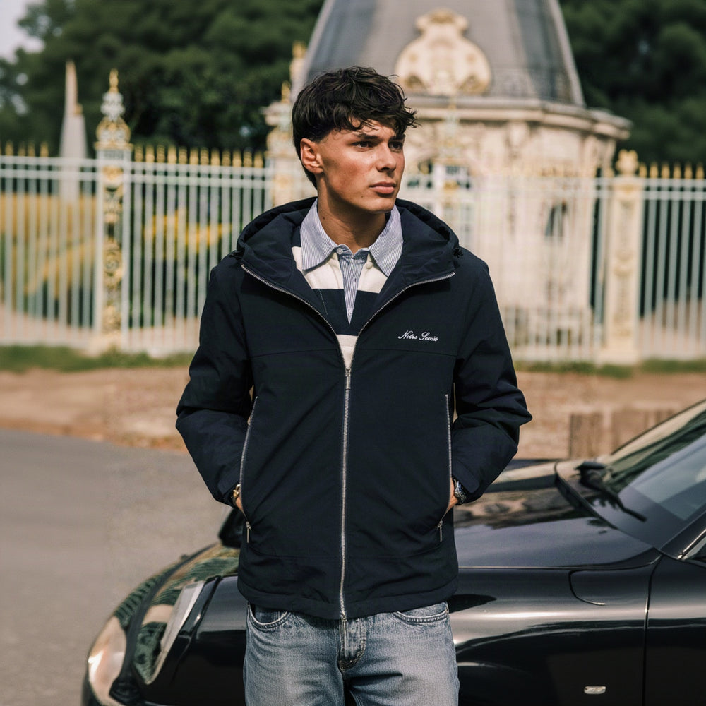 Heritage Winter Jacket in navy, worn open over a striped rugby shirt