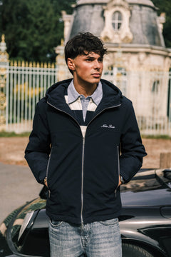 Heritage Winter Jacket in navy, worn open over a striped rugby shirt